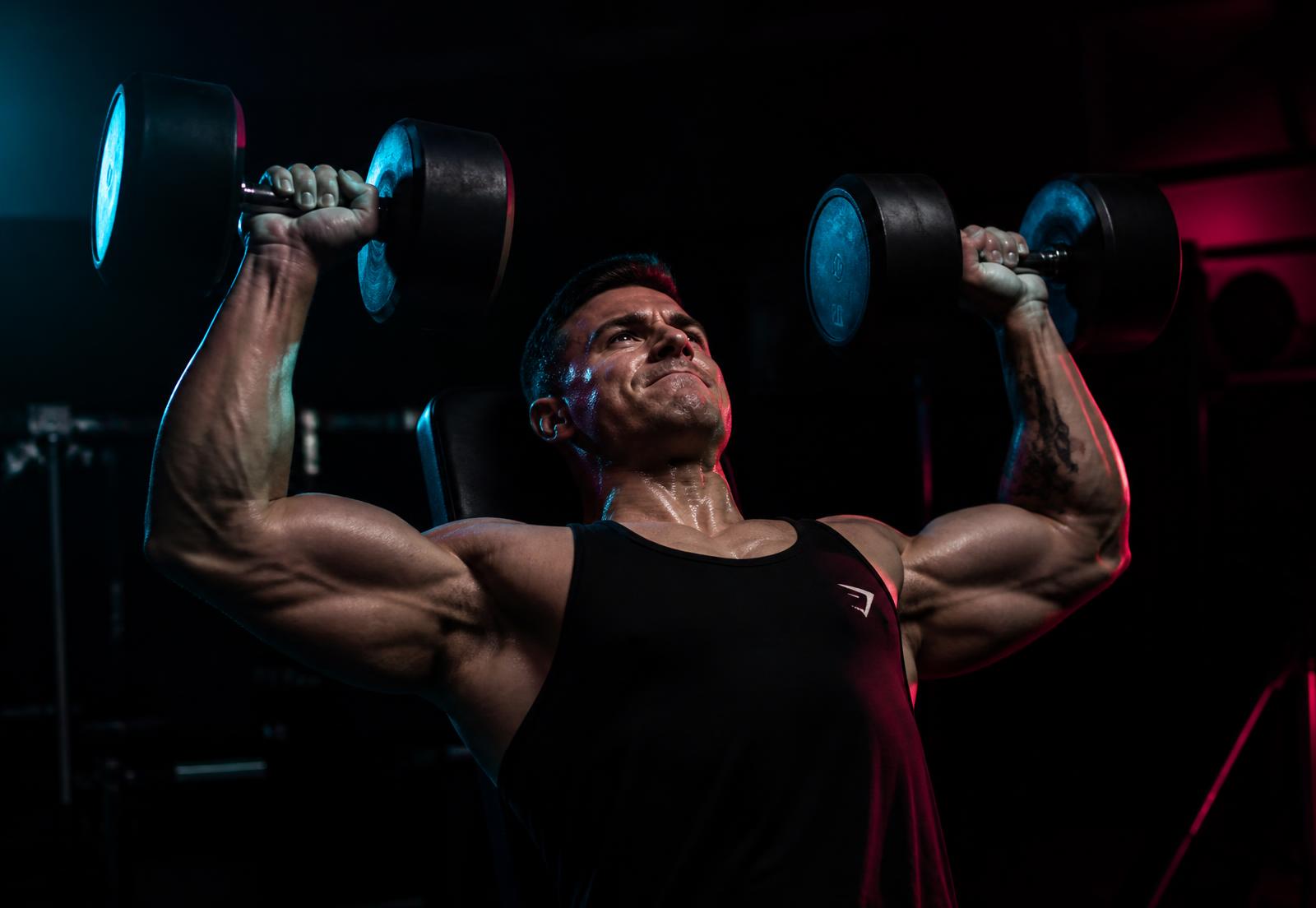 Member training with dumbbells at SMASH Gym and Fitness